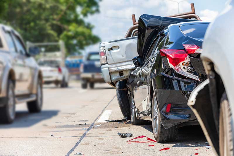 A scene of a rear-end car accident